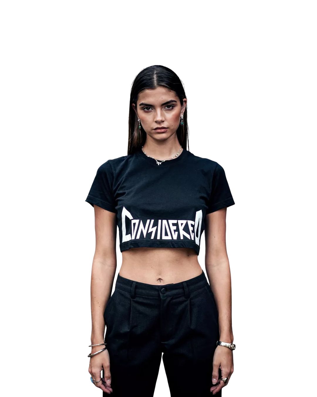 Person wearing a black crop top with 'CONSIDERED' text on a white background